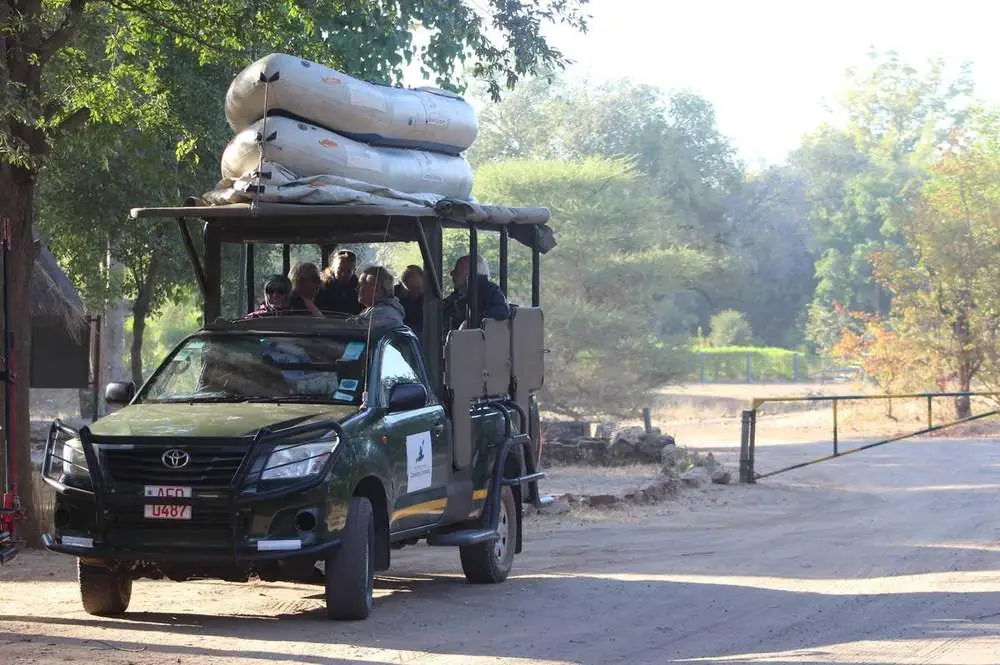 Our game-drive vehicle with canoes on the roof, collecting guests
